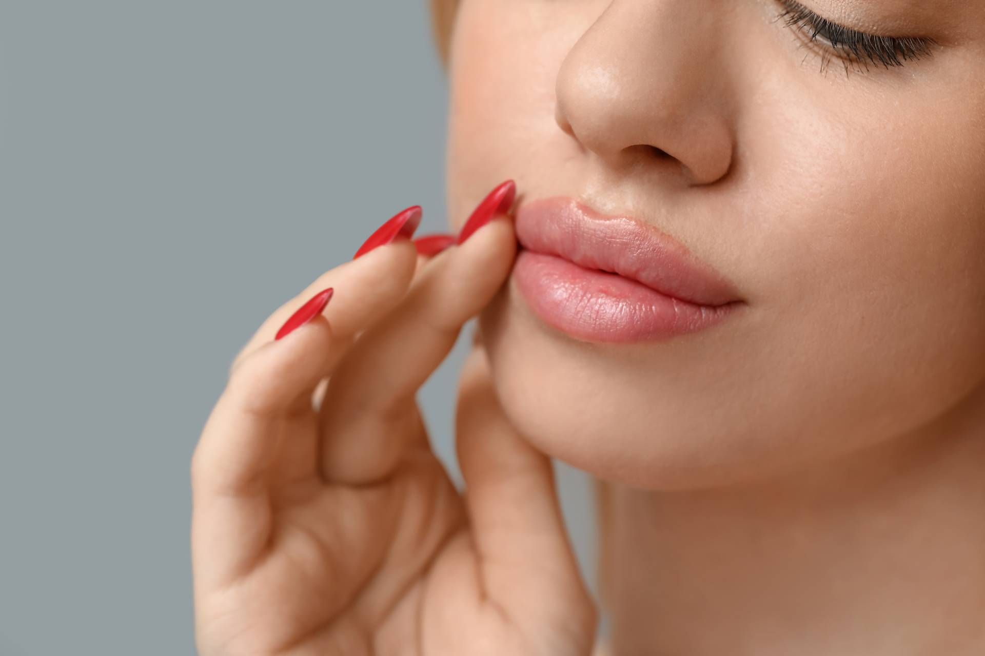 Woman with naturally enhanced lips after lip flip treatment in luxury Scottsdale clinic setting